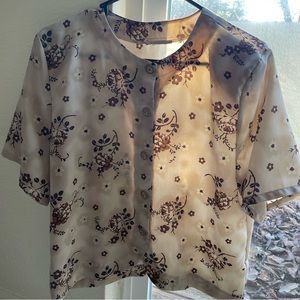Brown/Tan flower pattern button-up shirt.
